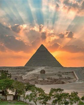 The sunset over the Giza Pyramids, as seen from Cairo.