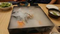 Sushi hidden by dry ice