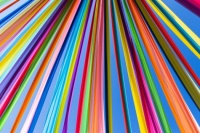 A close-up of colorful curtains installed in the streets of Tarare (France) for the "Fête des Mousselines 2025"  Tarare, France