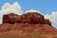 White Clouds Frame A Monument Valley Monolith