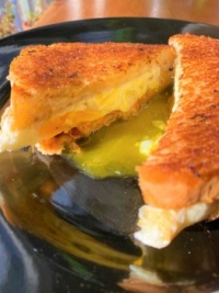 Breakfast sandwich - Grilled cheddar and Swiss cheeses with eggs