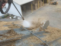 Pressure washing grain bin roof