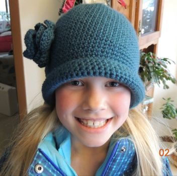 Lily modeling the hat I crocheted for her.