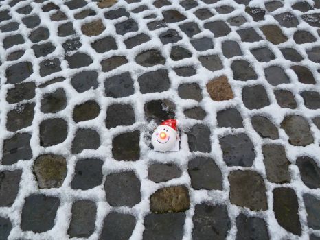 Snow and Santa on paving stones