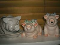 Three happy pigs