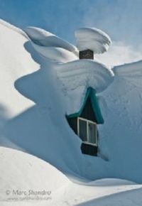 House peeking thru the snow