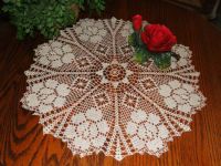 crocheted doily with rose
