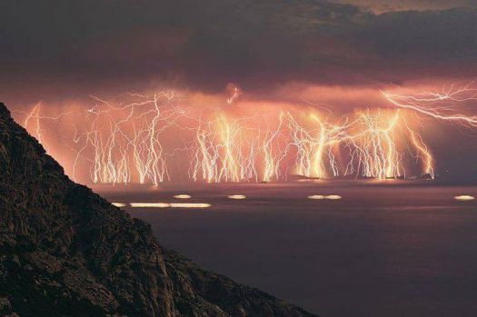 Lightning strikes the horizon in Ikaria island , Greece
