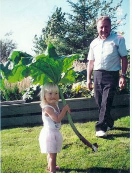 Walter and granddaughter, Sarah out in the garden.jpg
