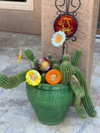 Potted cactus with colorful glass art