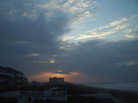 Sun Rising behind nearby hotel