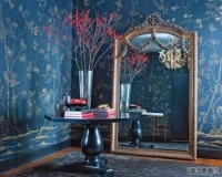 Does this inspire you?  Elle Decor featured this de Gournay wallpaper in a recent issue. It's the classic blue and white palette, in reverse.