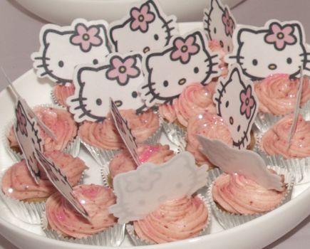 Mini Hello Kitty strawberry cupcakes.