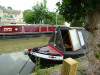 Serie: Narrow boats on a canal...... ,  the open door of a boat