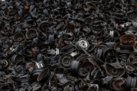 Damaged car tire rims lie in a dump in Gaillac, France