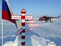candy striped North Pole sign