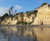 Pacific Beach - cliff geology with reflections