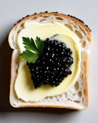 White bread is buttered and topped with black caviar and a small piece of parsley.