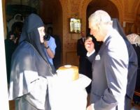 Last Off topic (1) - Britain's Prince Charles is greeted with bread and salt at the entrance of Saint Mary Magdalene's church...