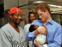 Prince Harry holding a baby! <3