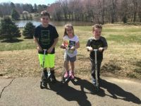 Chase,chloe and Bruce on scooters at our lake