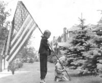 Me and my little sister raising the flag about 1953