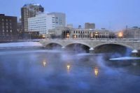 Steam rises above the Des Moines River in downtown Des Moines, Iowa, in 2010.