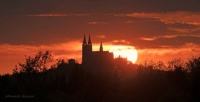 A fiery sunset fills the sky over Holy Hill.