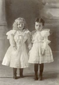 Vintage Photo Of A Girl With a Large Doll....And They Wear The Same Size!