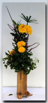 Yellow Mums in a Bamboo Vase