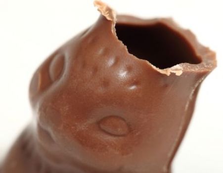 What part of the chocolate bunny do most people eat first?