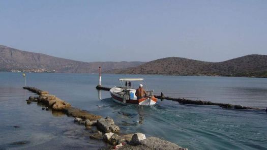 FISHERMAN RETURNING HOME WITH HIS CATCH, ELOUNDA