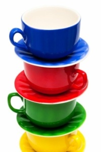 Brightly coloured cups and saucers