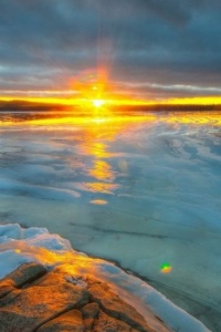 Sunset over icy water