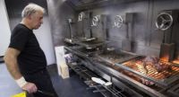 Chef Victor Arguinzoniz grilling meat
