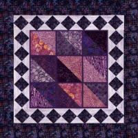 Patchwork Quilt in Purple and Pink