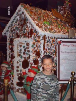 A Real big Gingerbread House and my son. Inn of the Mountain Gods in Ruiodoso N.M.