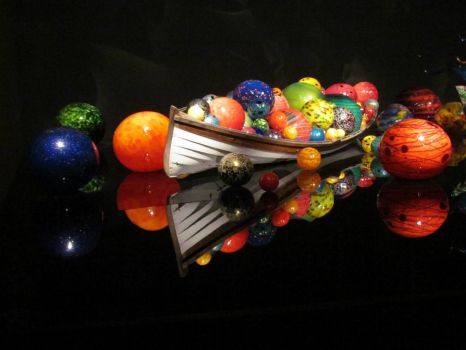 Hand-blown glass spheres in a row boat
