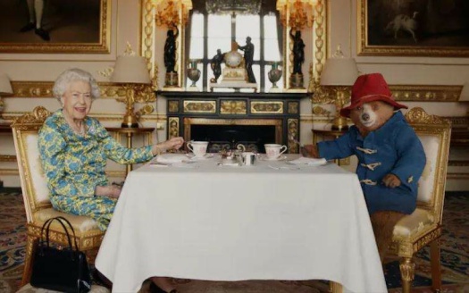 The Queen having tea with Paddington Bear