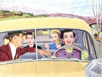 A man and three women in a car