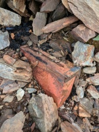 Ammo can in rocks