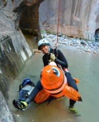 Woman Rappelling with a Clown Fish