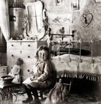 Vintage Photo Of A Girl And Her Dolls In Her Bedroom