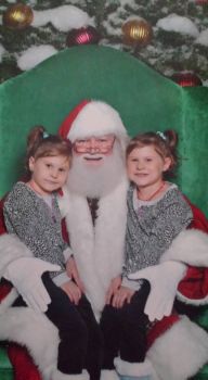 My granddaughters 1st time on Santa's lap.