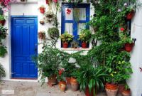 Blue door and window in Cordoba, Spain, by Laura