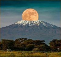 Mount Kilimanjaro giving birth to the Moon