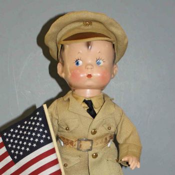 #4.Vintage Composition "Skippy" Doll In Military Uniform With The U. S. Flag (48 stars, haven't counted them)