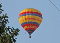 Hot air balloon passing over backyard