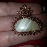 yellow calcite pendant wrapped in copper