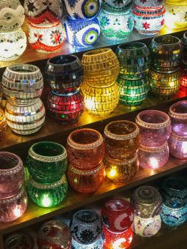 assorted-mosaic-glass-candle-holders-on-shelf-2386148